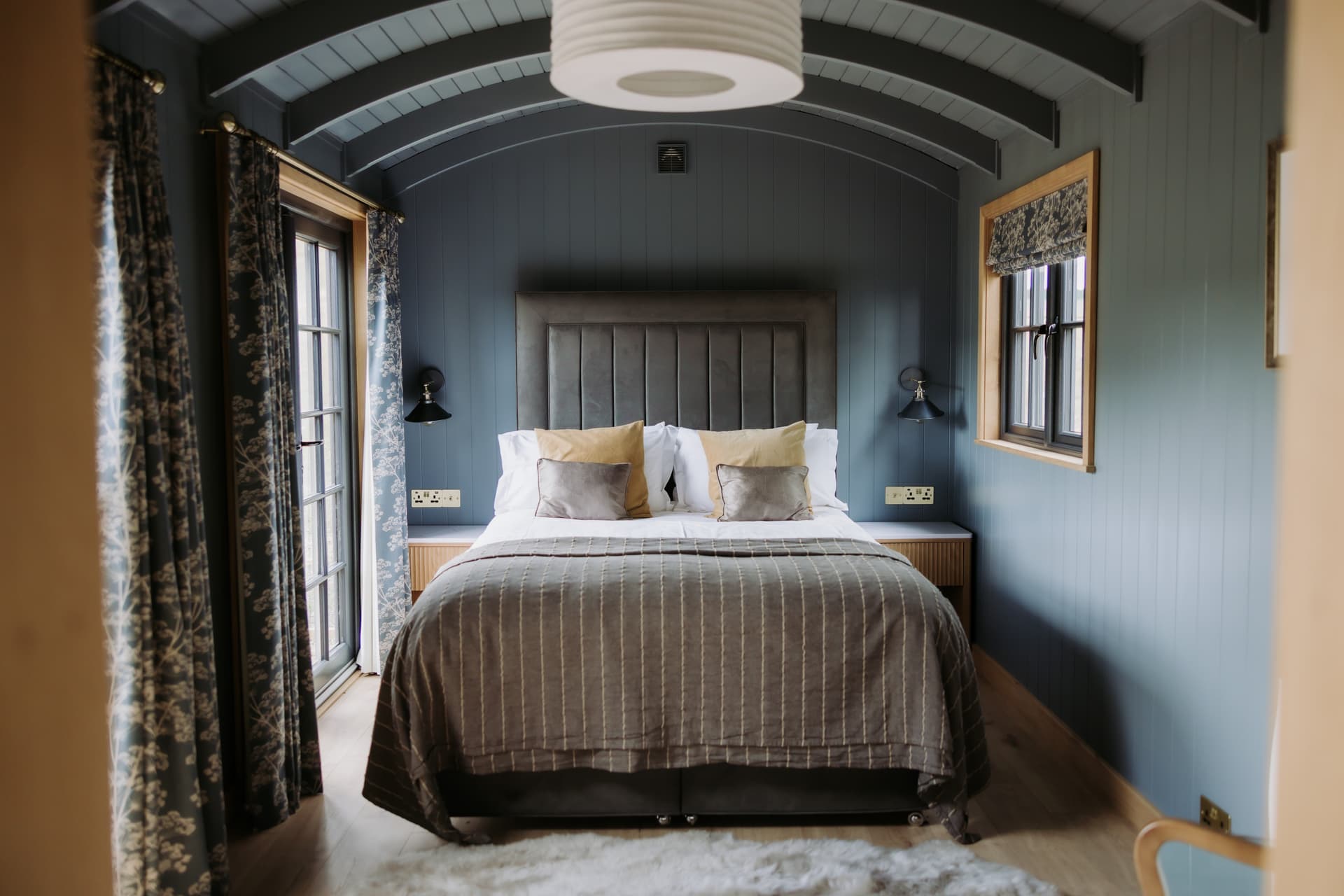 A shepherd hut bedroom made up for the wedding night