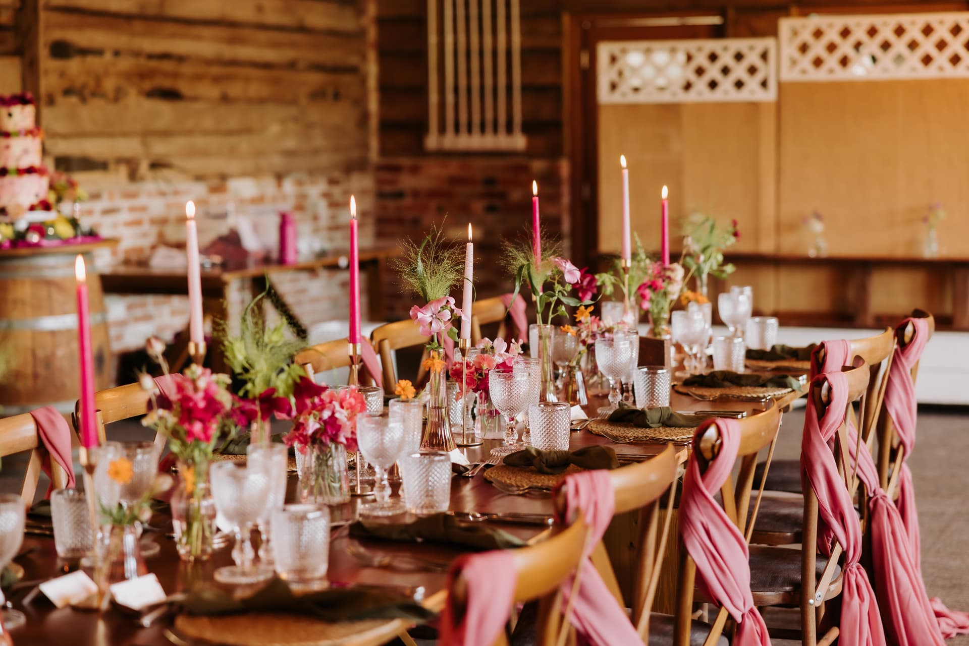 The long table laid for the wedding breakfast, candles lit