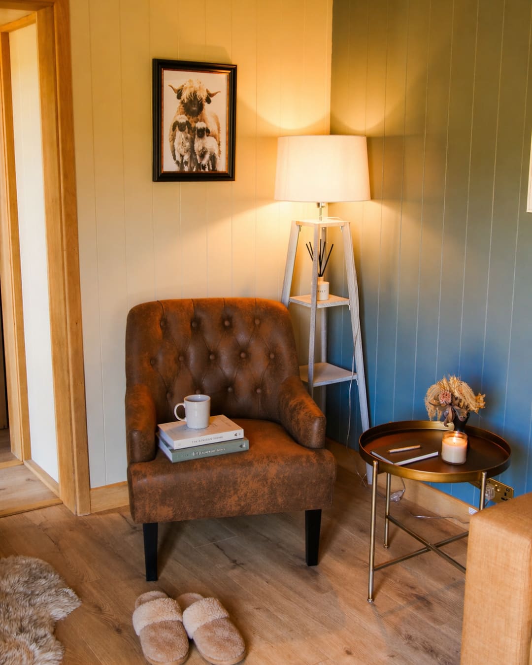Inside a hut, an armchair, a lamp and slippers waiting